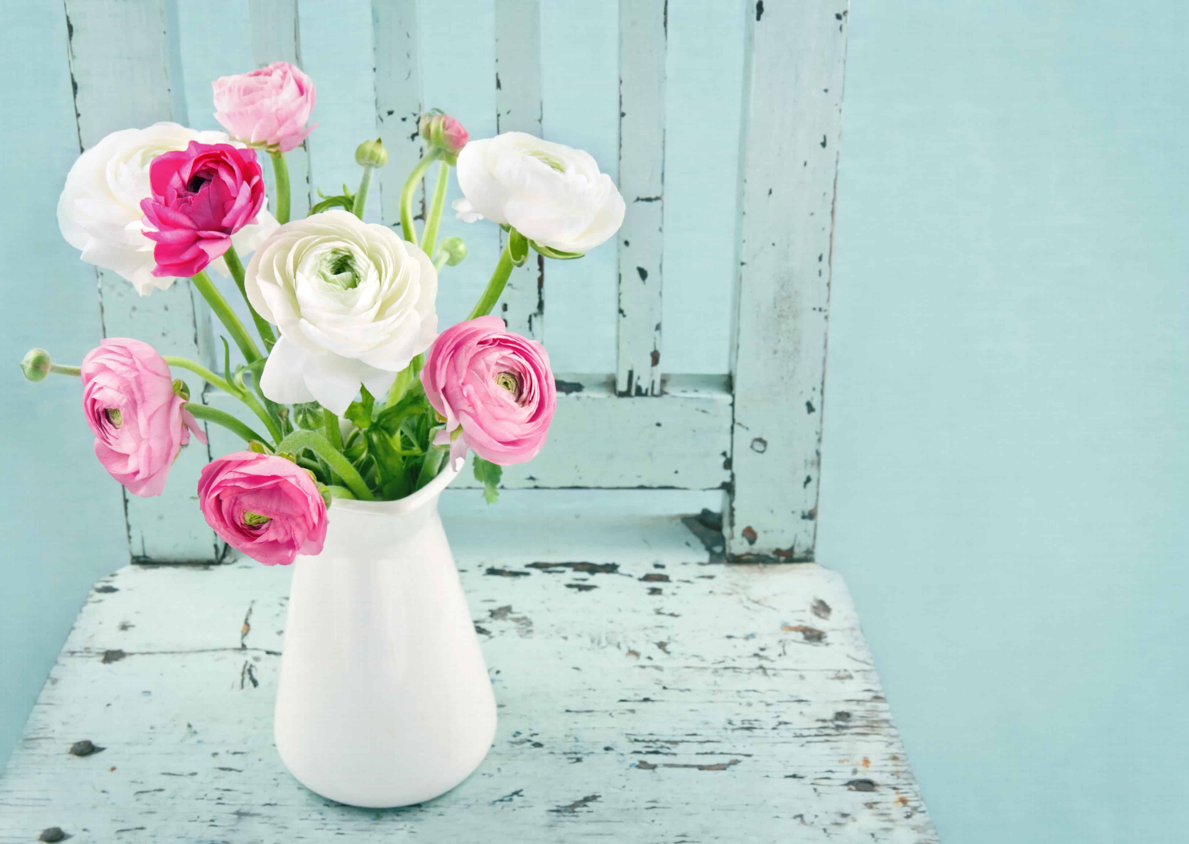 White and pink flowers on light blue vintage chair